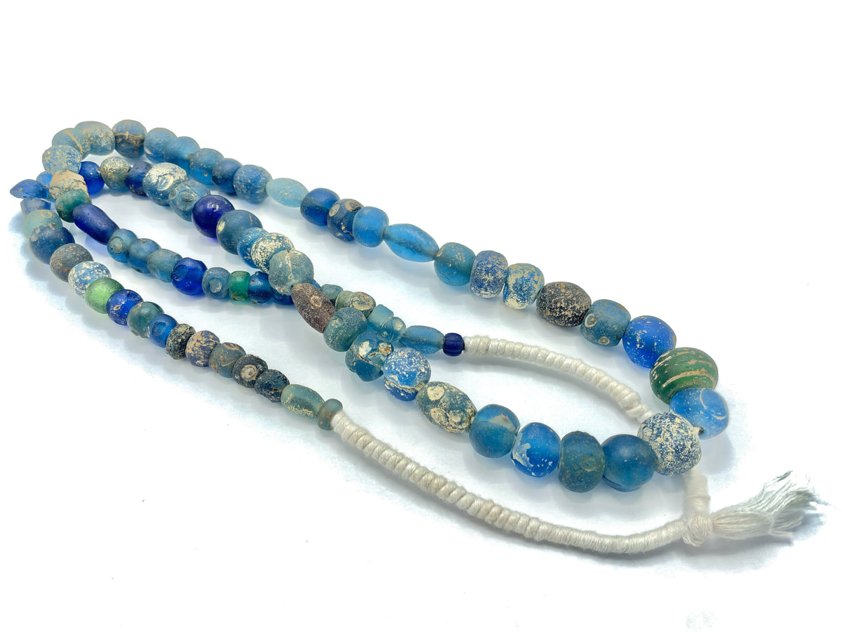 A Strand of Ancient Early Islamic Glass Beads, in Blue and Green, Some with Eyes  - Rita Okrent Collection (AG111p)