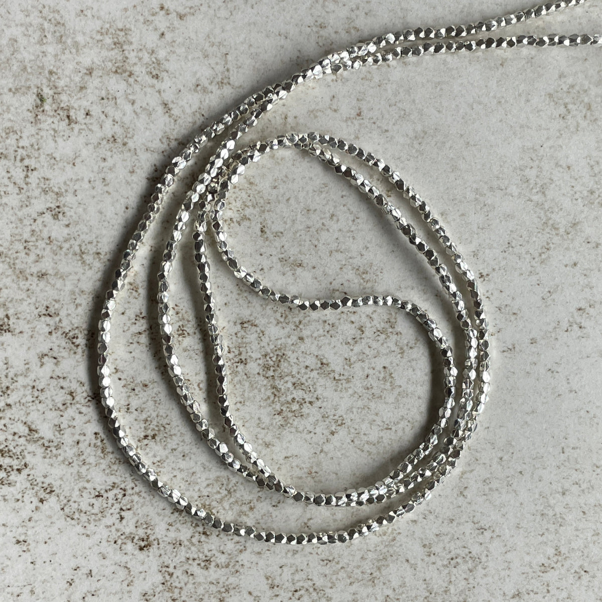 Long Strands of Tiny Faceted Sterling Silver Beads from the Thai Karen Hill Tribe - Rita Okrent Collection (NP104)