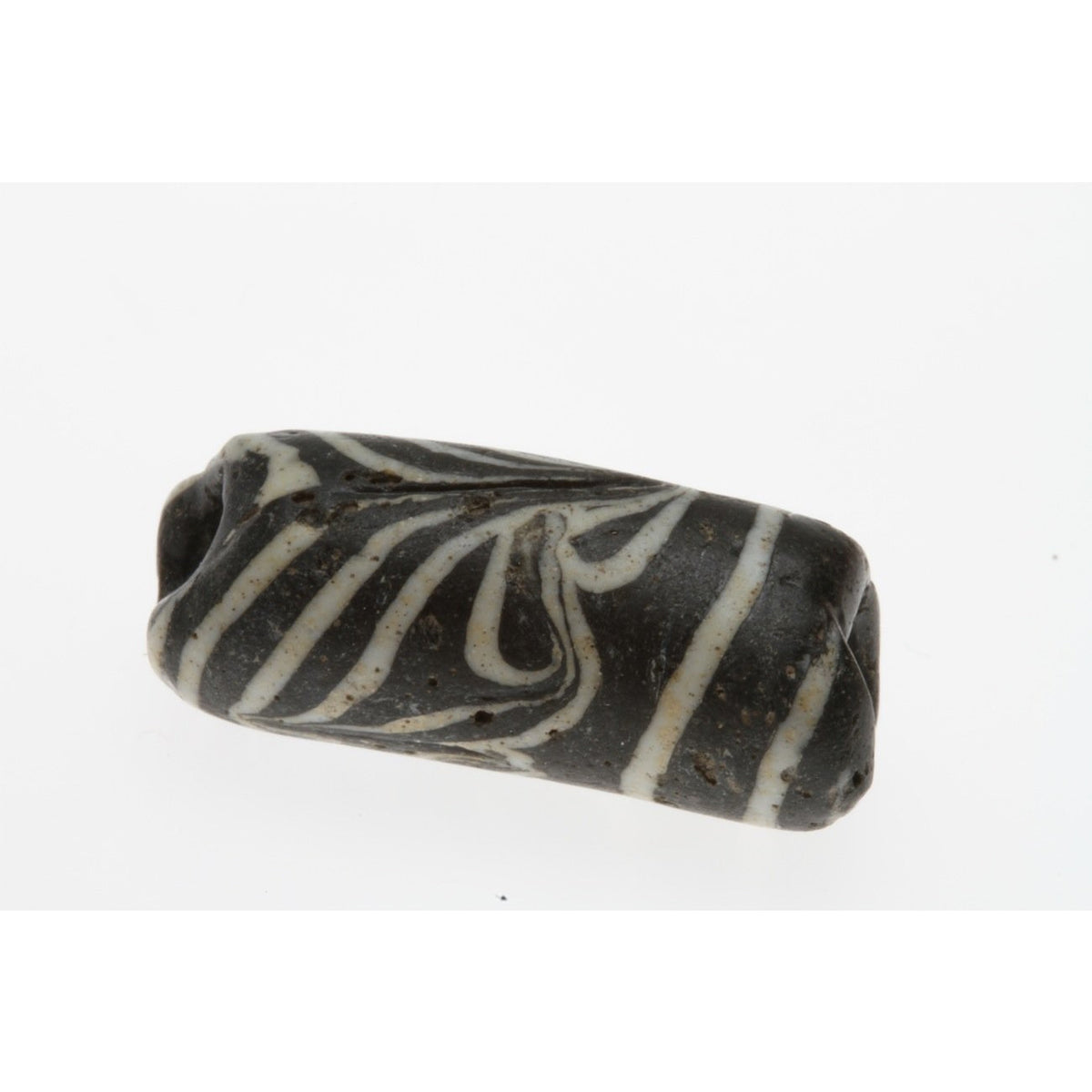 Early Islamic Black Tube Bead with White Trailing, Middle East 