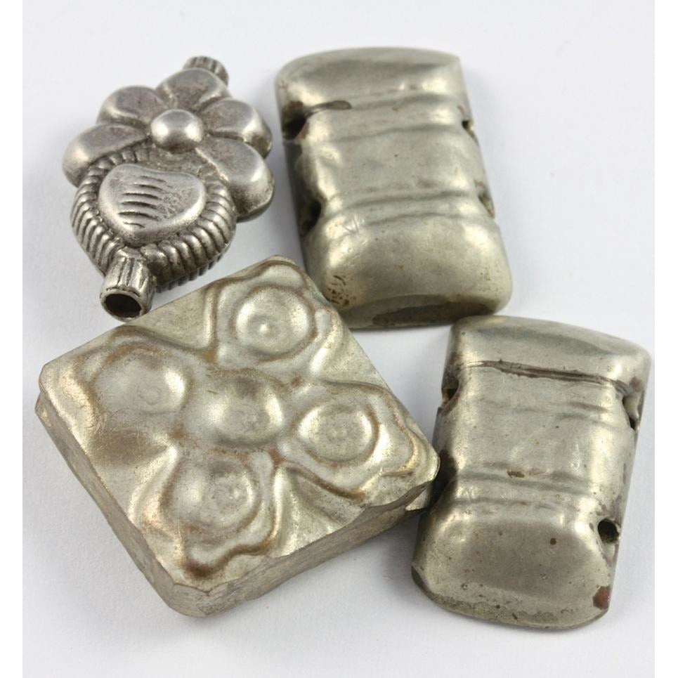 Rectangular, square and flowered hollow Bedouin silver pendants, group of 4, old