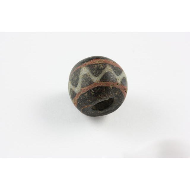 Early Islamic  Bead, Black with Red Stripes and White Trails, Egypt