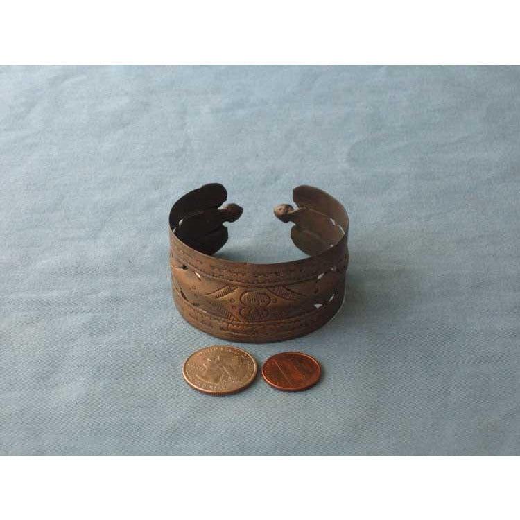 Antique copper bracelet with decoration