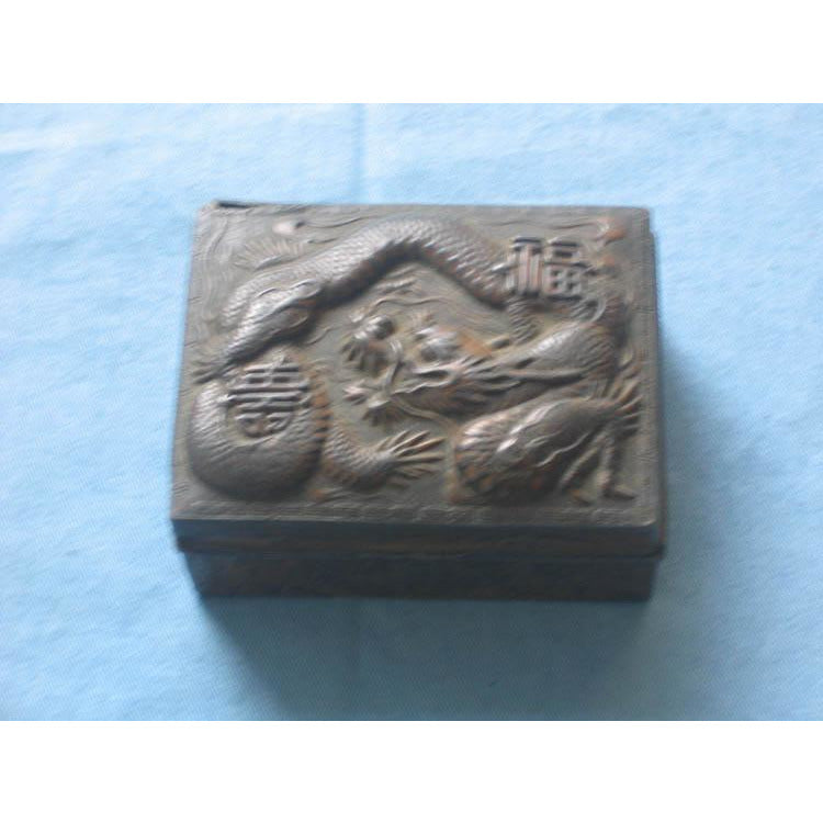 Silver box with elaborate external design, lined with wood interior