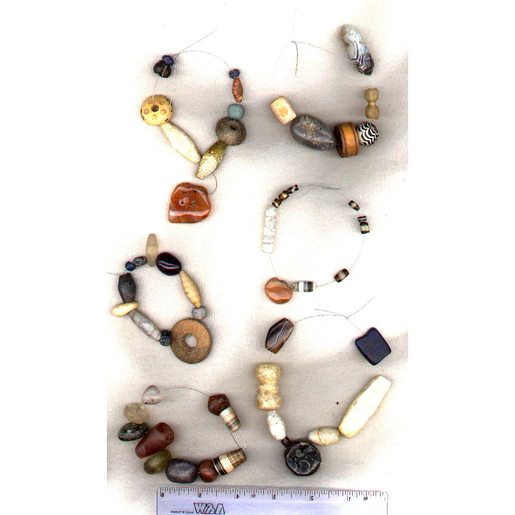 Strand of mixed very old stone beads