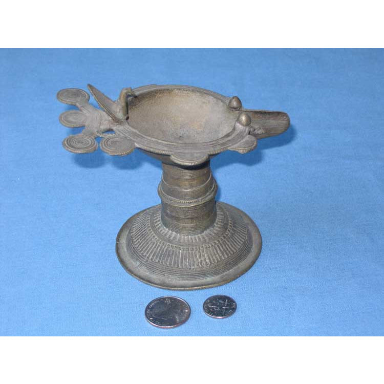 Iran or India, Cast brass oil lamp on a pedestal foot