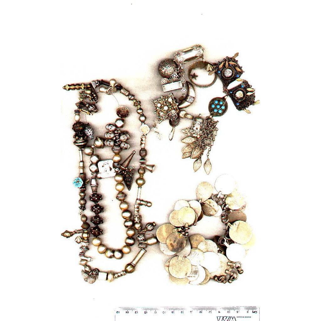 Collection of mixed beads and pendants, left outer